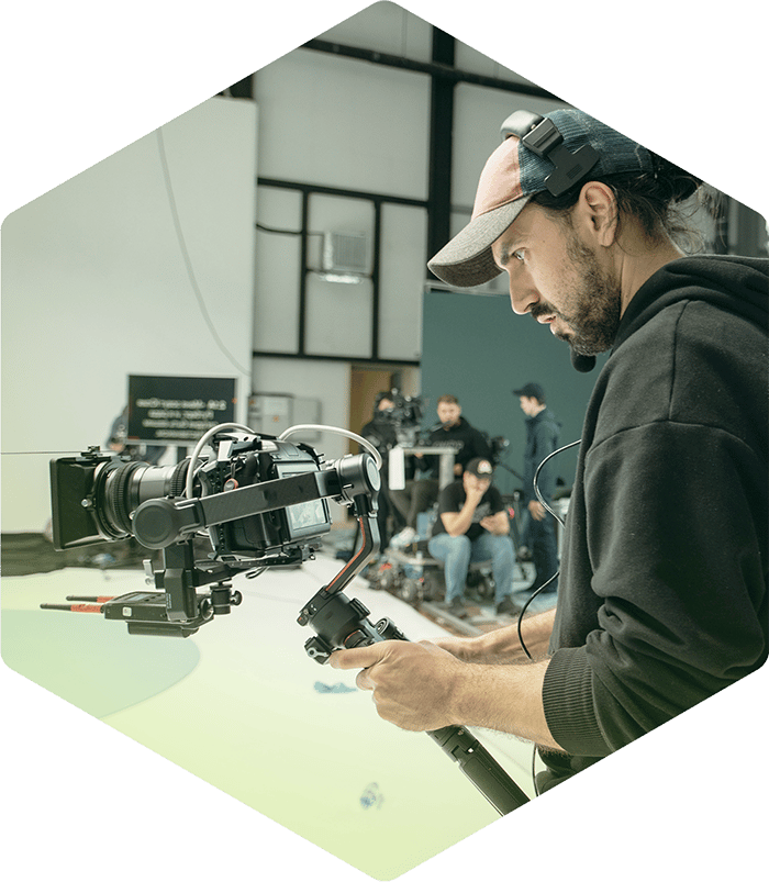 Production team member holding video camera