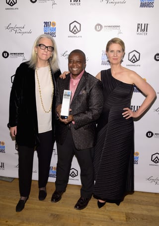 Producer Joslyn Barnes and Director/Producer Yance Ford with their Strong Island Best Documentary Award and Cynthia Nixon in the GreenSlate Greenroom at the 2017 Gotham Awards in New York City